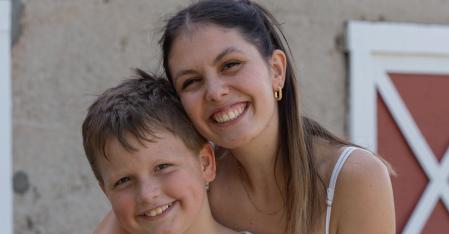 au pair hugging host kid