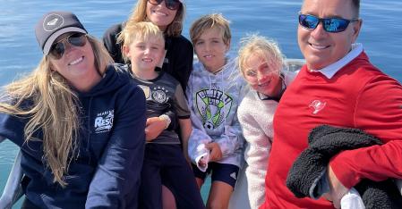 au pair with her host family on a boat