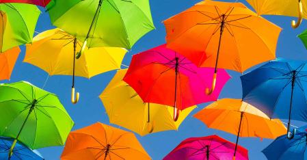 colorful umbrellas in a blue sky